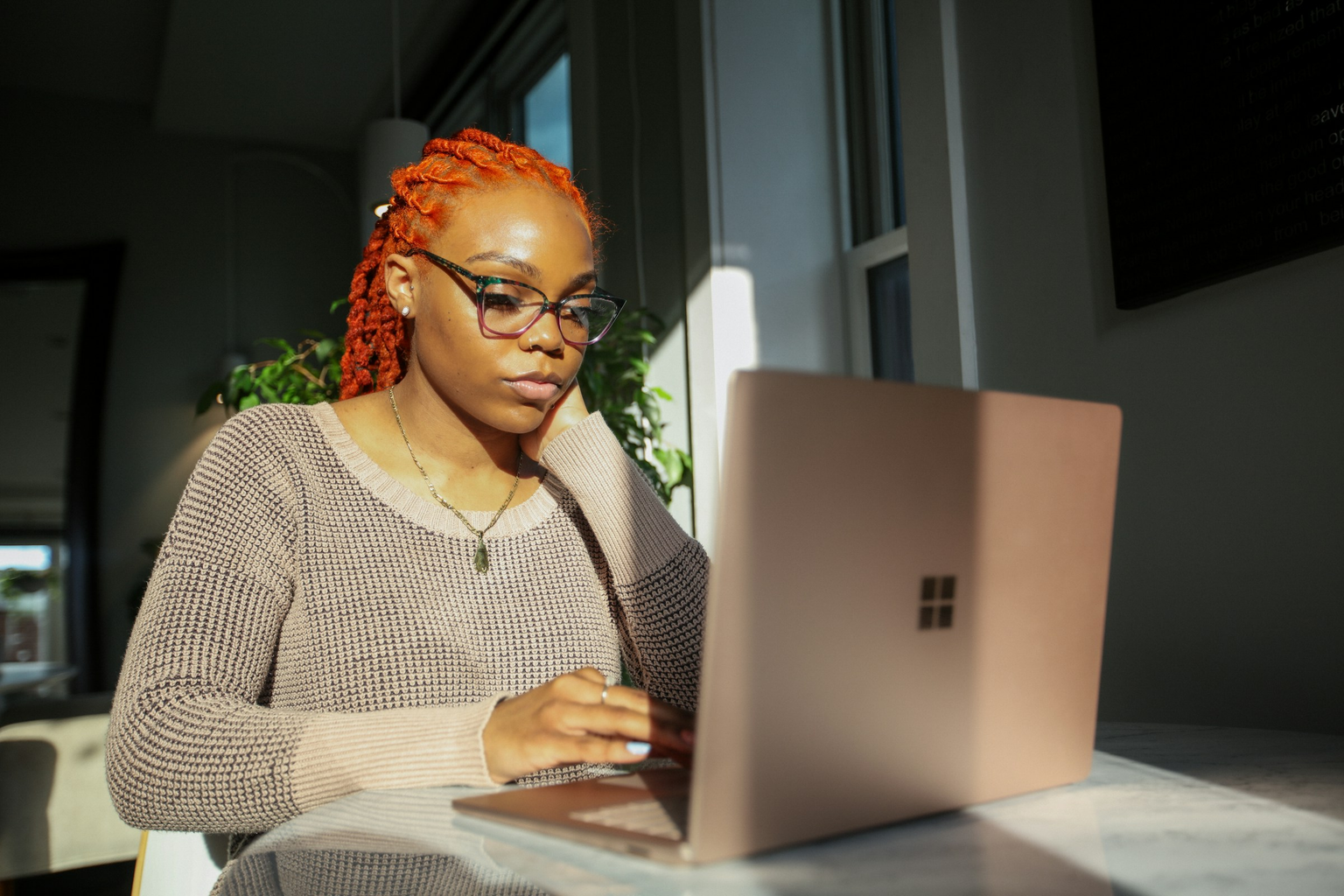 Cebridge Digital analyst working by natural window light