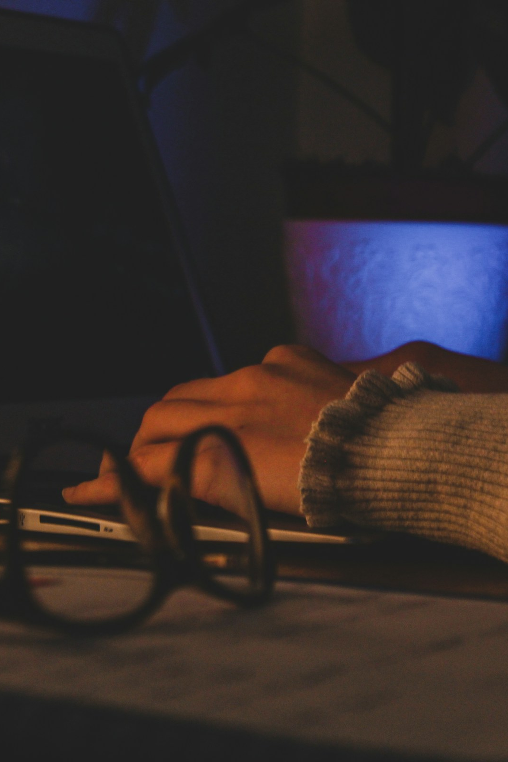 Close-up of hands on a laptop — Praxa in production